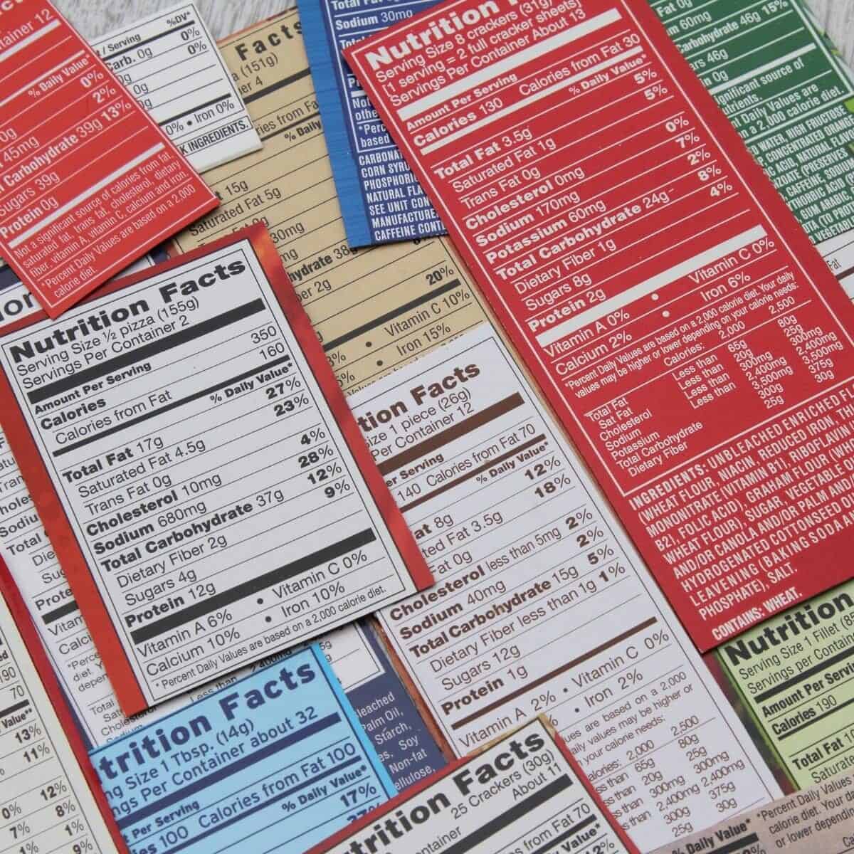 Assorted nutrition facts labels on processed foods, featuring various colors and details about serving sizes, calories, fats, vitamins, and minerals.