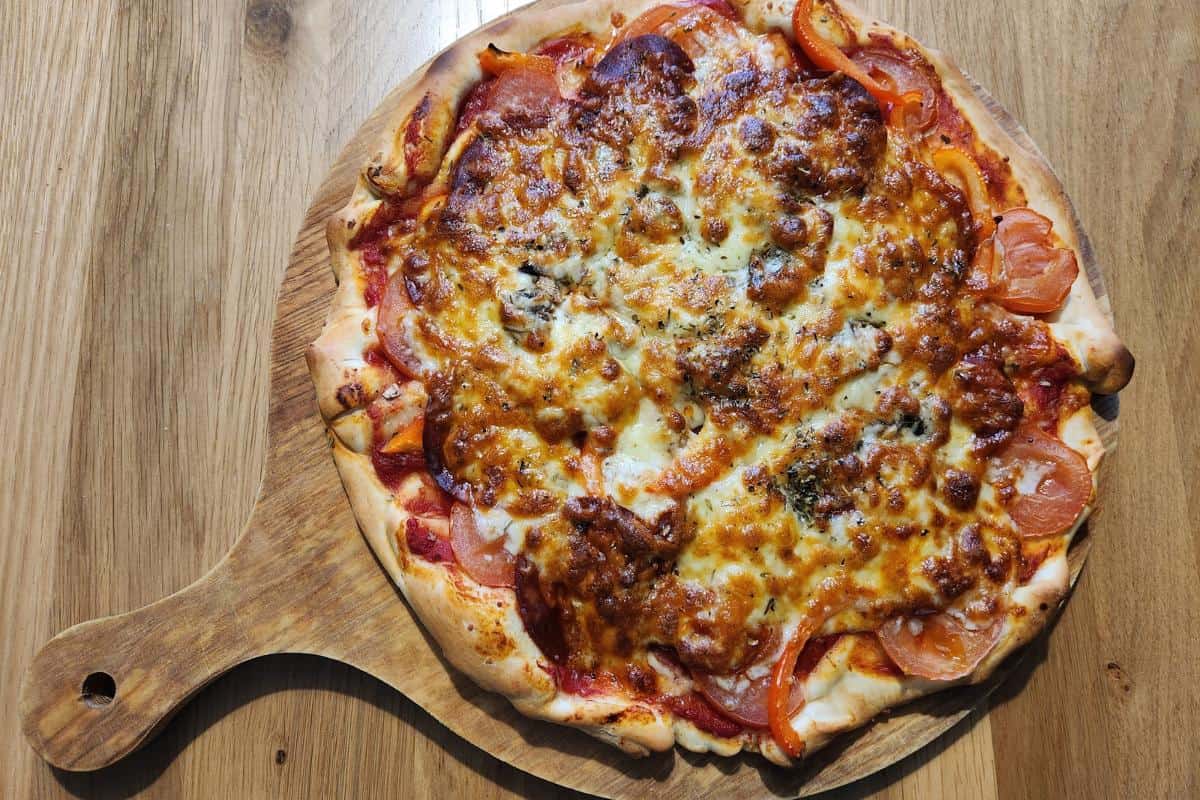 homemade pizza on a wooden board