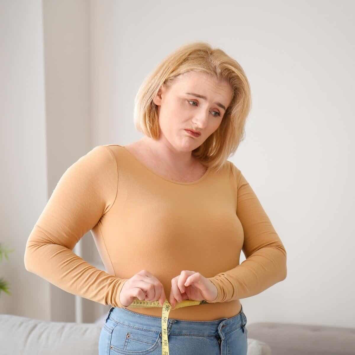 lady sad as she is gaining weight not losing weight