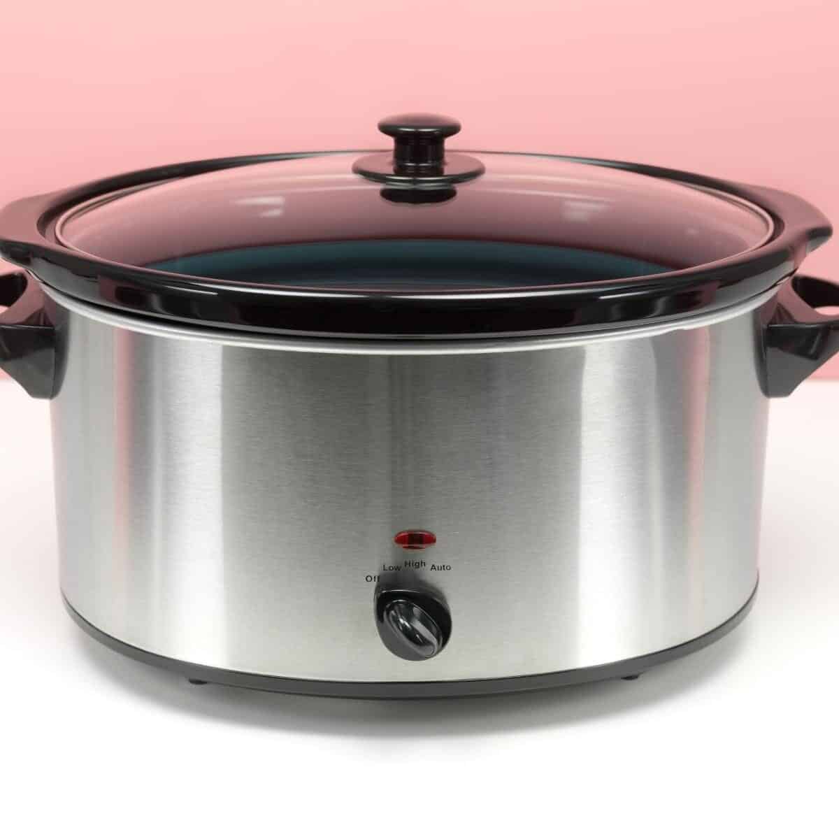 slow cooker on white background