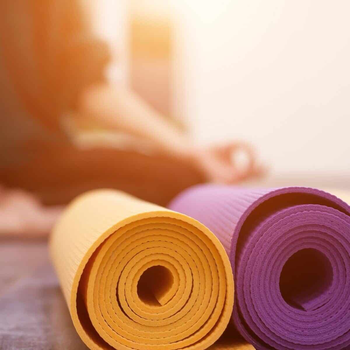 yoga mats outside rolled up